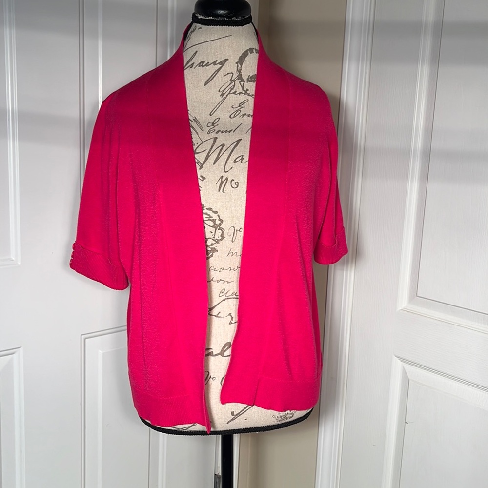 Hot pink cardigan.